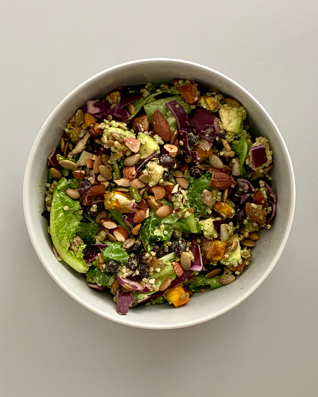 Green bowl with black beans and tahini dressing